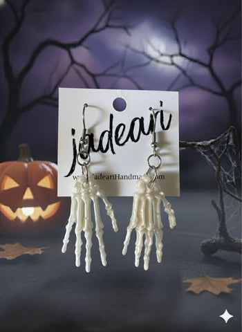 Skeleton Hands Dangle Earrings in Bone White